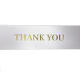 white ribbon with gold Thank you text