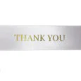 white ribbon with gold Thank you text