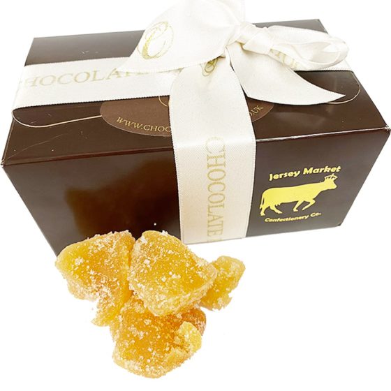 Brown chocolate box with crystallised ginger chunks outside