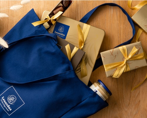 Gold gifts in Leonidas blue bag