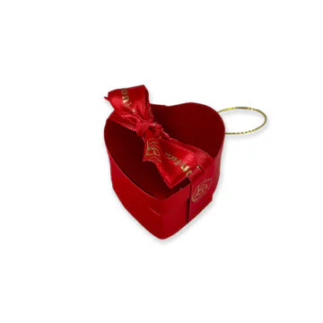 small red velvet heart tied with red leonidas ribbon