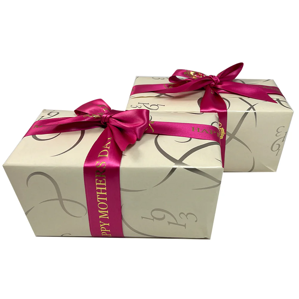 2 Boxes Of Chocolates Wrapped In Champagne Coloured Paper And Pink Mothers Day Ribbon