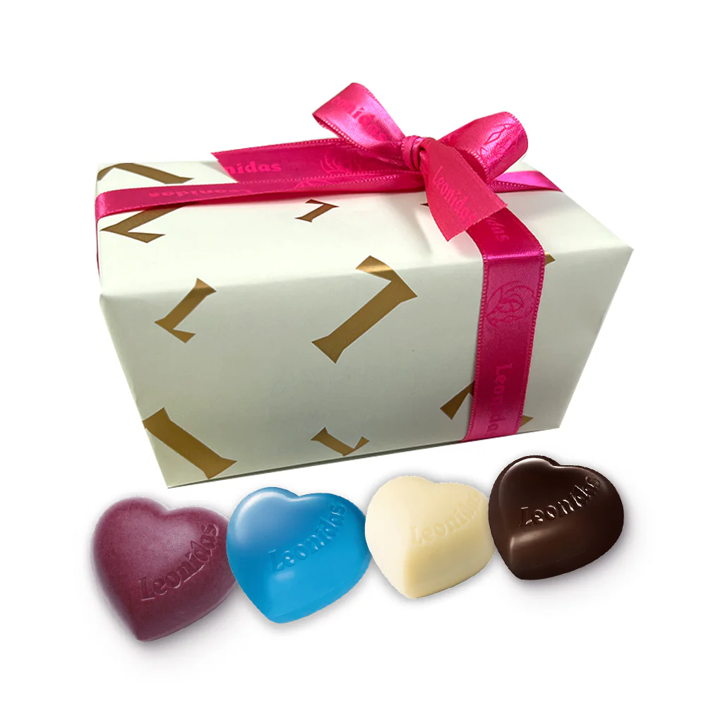 Box Of Chocolate Hearts Wrapped in Cream Leonidas Paper And Pink Leonidas Ribbon