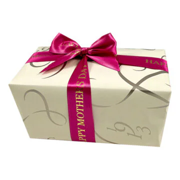 Ballotin wrapped in cream paper and pink Mothers Day Ribbom