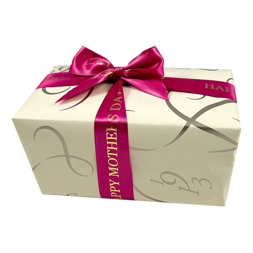 Ballotin wrapped in cream paper and pink Mothers Day Ribbom