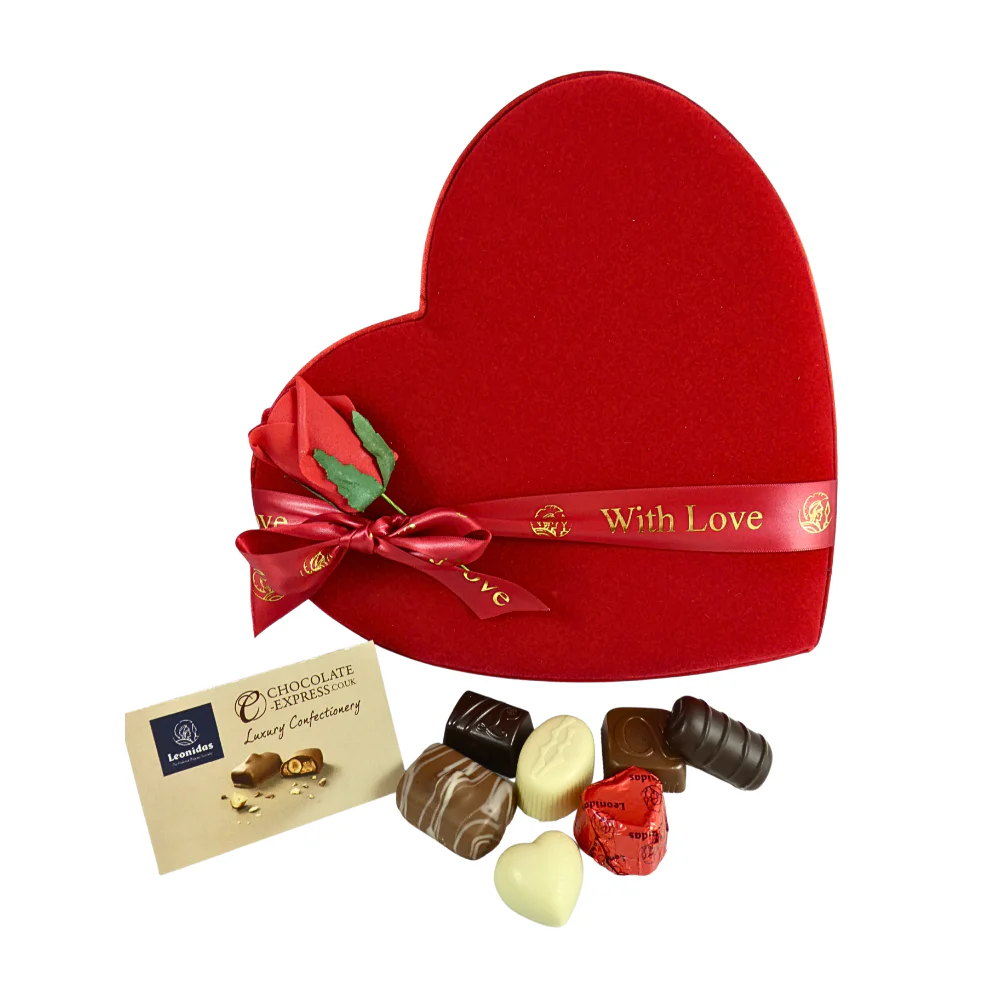 Red Fabric Heart with Ribbon And Decorative Red Rose And Chocolates Infront
