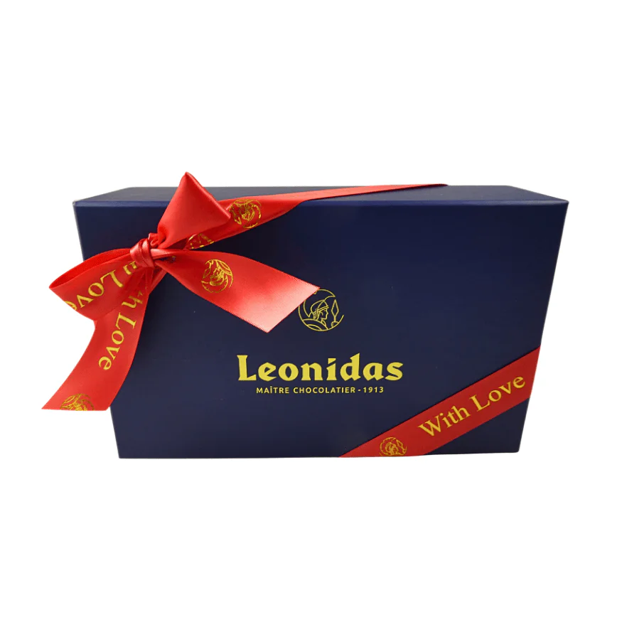 A Blue Leonidas gift box with a red ribbon and the words, "With Love."