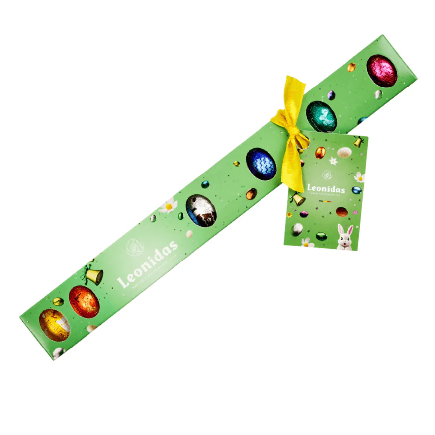 A Green Tube Filled with Leonidas Mini Eggs, with Flavour Guide Tag