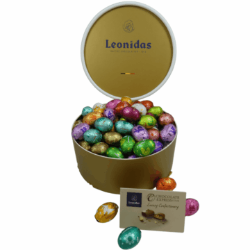 a large round box of Leonidas colourful mini eggs