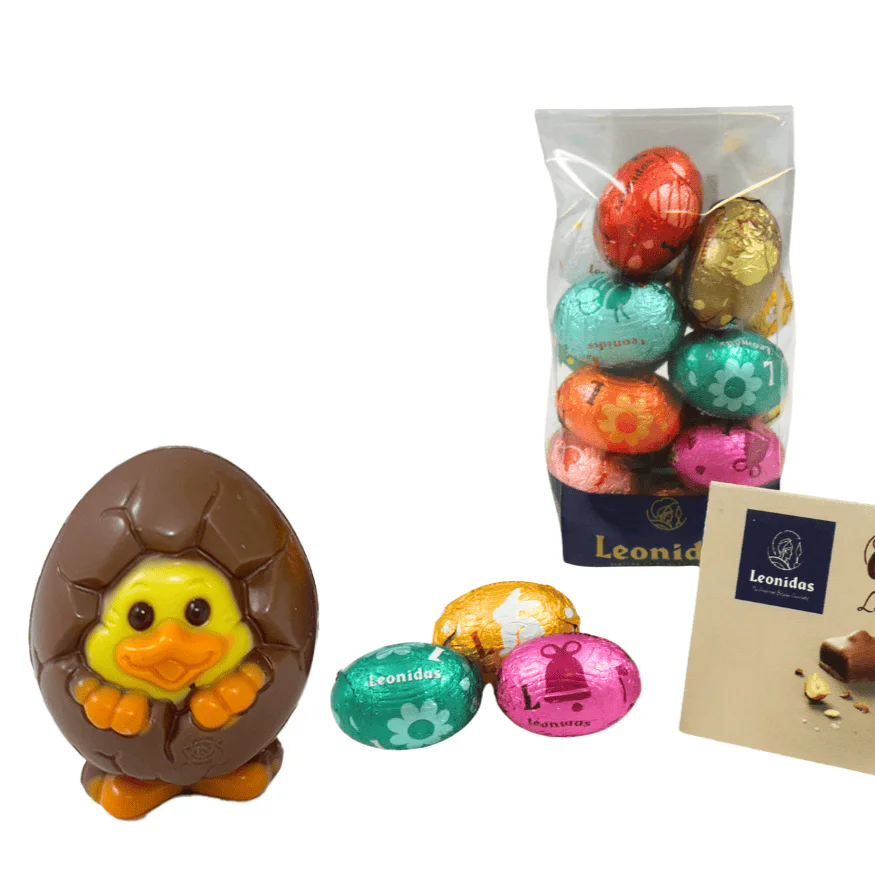 a bag of colourful foil wrapped chocolate mini eggs and a milk chocolate chick in a shell