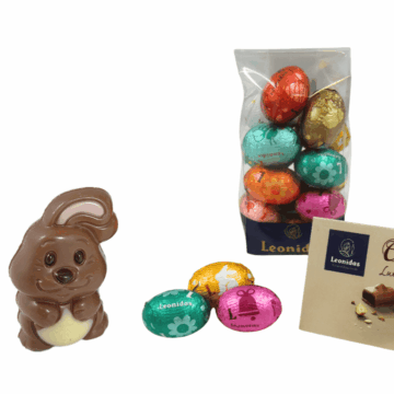 a bag of colourful foil wrapped chocolate mini eggs and a milk chocolate chick in a shell