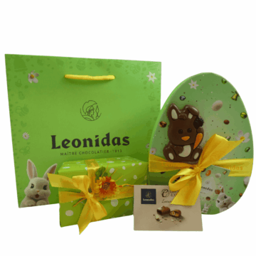 easter leonidas green bag with an oval box of mini eggs, and a milk chocolate bunny lolly and a smaller box of leonidas chocolates wrapped in easter green wrapping paper