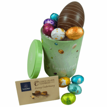 a large green cylinder filled with foil wrapped leonidas mini eggs and a larger milk chocolate hollow egg