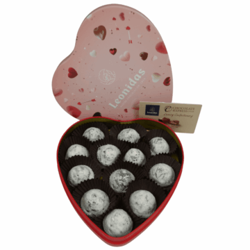 a pink leonidas tin heart filled with champagne truffles