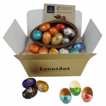 a milk chocolate egg shell filled with foil wrapped leonidas mini eggs in a gold leonidas box