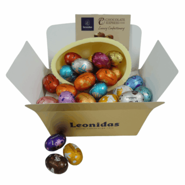 gold leonidas box with a white chocolate egg shell inside filled with foil wrapped mini eggs