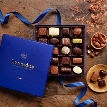 open blue square leonidas gift box filled with chocolates