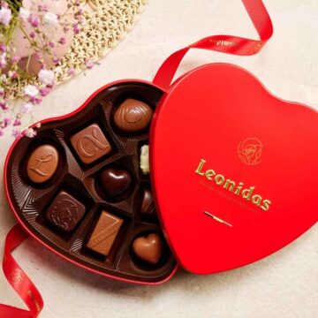 open red heart leonidas gift box filled with chocolates