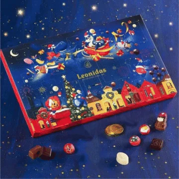 kids leonidas advent on blue background with chocolates in front