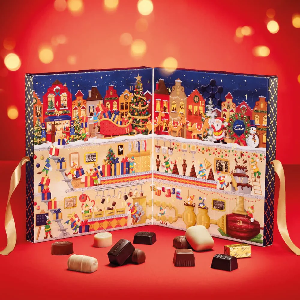 leonidas advent calendar on red background with chocolates in front